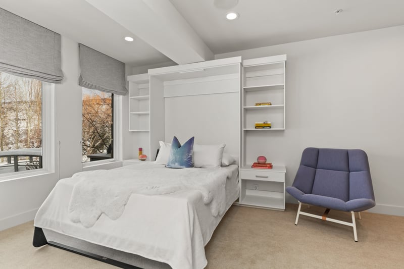 Clean design and built-in storage highlight this flexible guest suite with Queen Murphy bed.