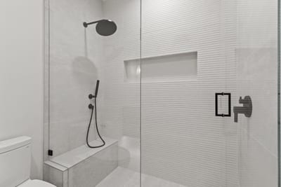Attached to Bedroom 5, this sleek ensuite includes a walk-in shower and modern finishes.