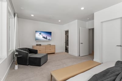 Second angle of Bedroom 6 reveals built-in shelving and ensuite access.