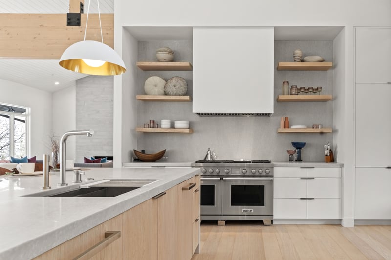 Cook with ease in your gourmet kitchen with custom cabinetry, a large island, and designer lighting.