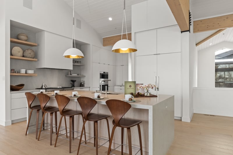 Bar seating for five and modern pendant lights make casual meals and conversation easy.