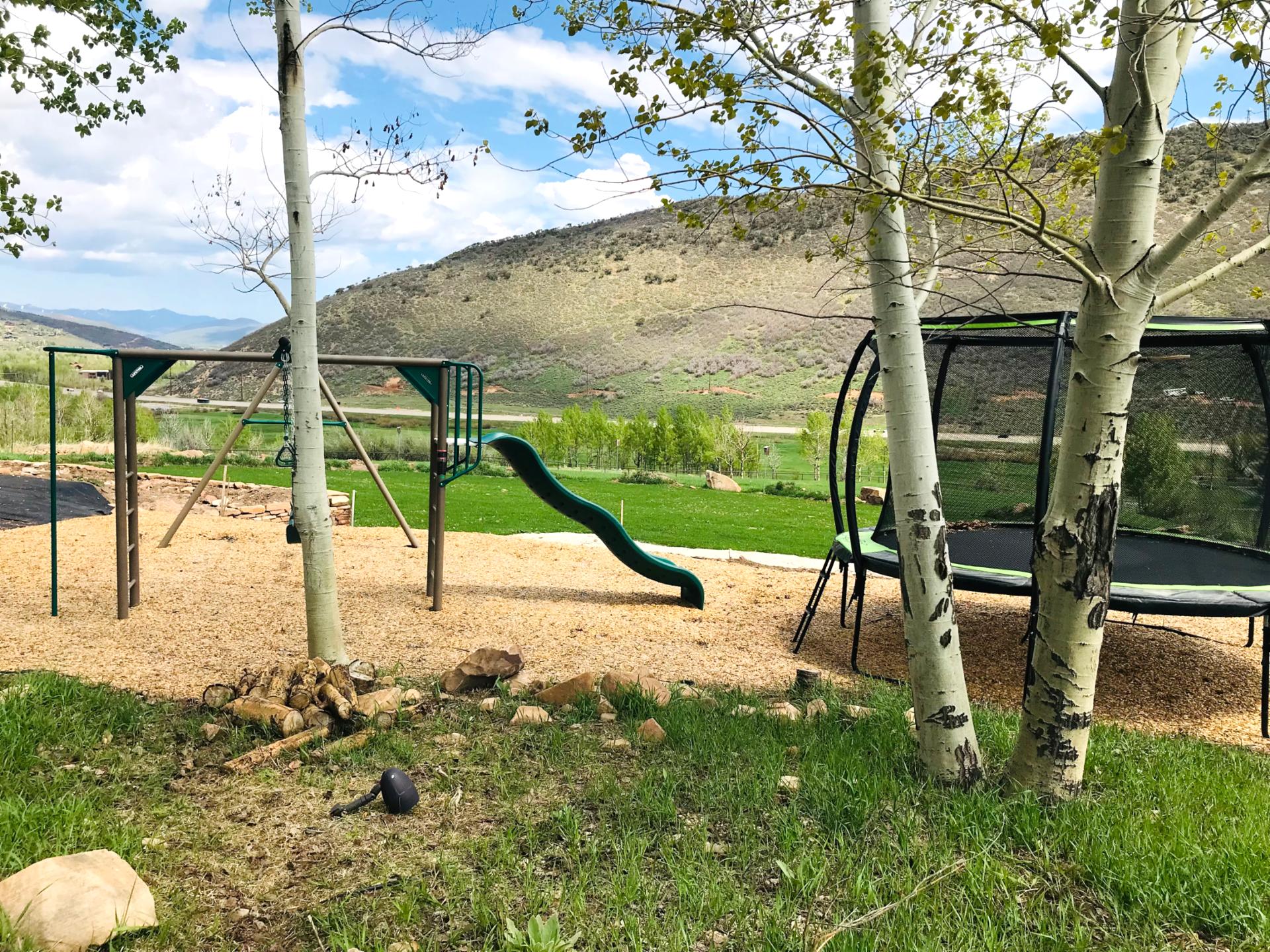 Let kids explore the private playground complete with slide and swing set.