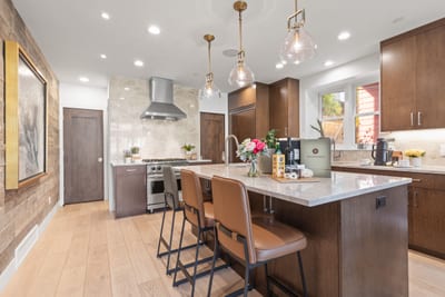 Sleek design and premium appliances make this modern kitchen perfect for prepping family meals or après-ski spreads. PEA-1009