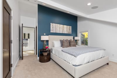 Sleep soundly in this Queen bedroom with ample natural light and plush bedding. PEA-1009