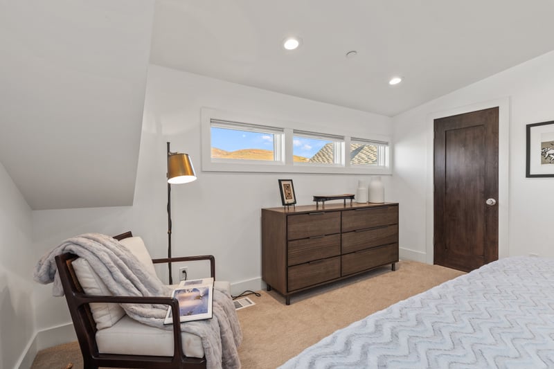Additional angle of guest bedroom highlights clean lines and generous floor space. PEA-1009