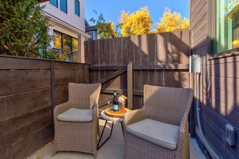 Step outside to your private sitting area with chairs and mountain sun. PEA-1009