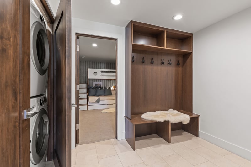 Built-in hooks and bench seating offer a stylish place to stash boots, jackets, and gear. PEA-1009