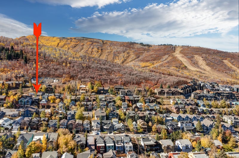 An aerial view reveals the home’s ideal location in a scenic neighborhood near outdoor adventures. PEA-1009