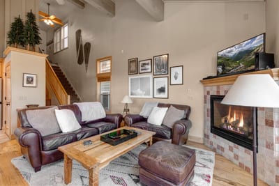 Gather in your main living area with a gas fireplace, vaulted ceilings, and cozy seating. Perfect after mountain adventures.