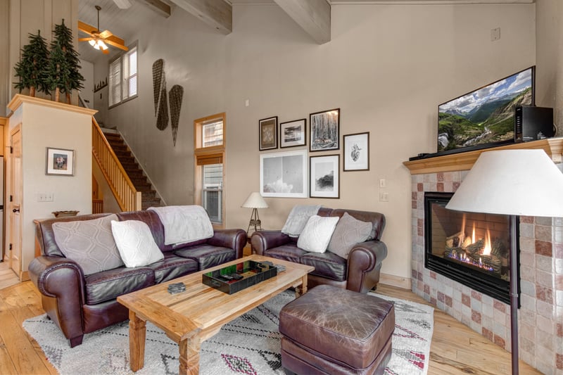 Gather in your main living area with a gas fireplace, vaulted ceilings, and cozy seating. Perfect after mountain adventures.