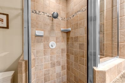 Enjoy the convenience of a second step-in shower in the third bath, located near the bunk room.