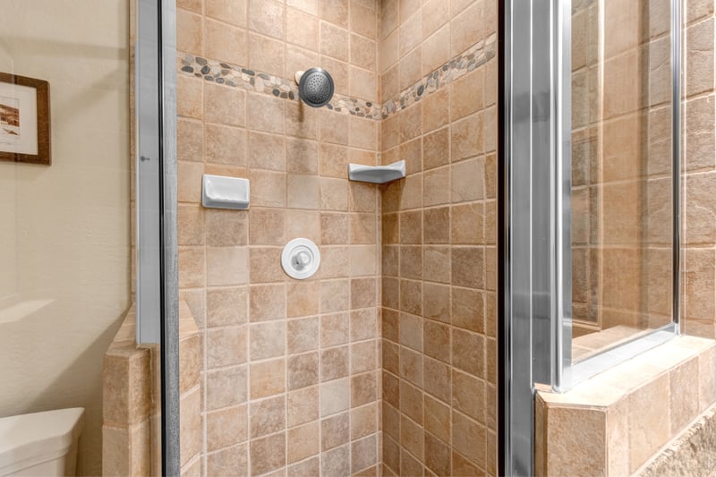 Enjoy the convenience of a step-in shower in the third bath, located near the bunk room.