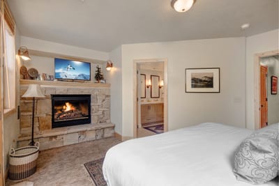 Enjoy the privacy of your lower-level suite with a King bed, gas fireplace, and direct access to the bath with walk-in shower.
