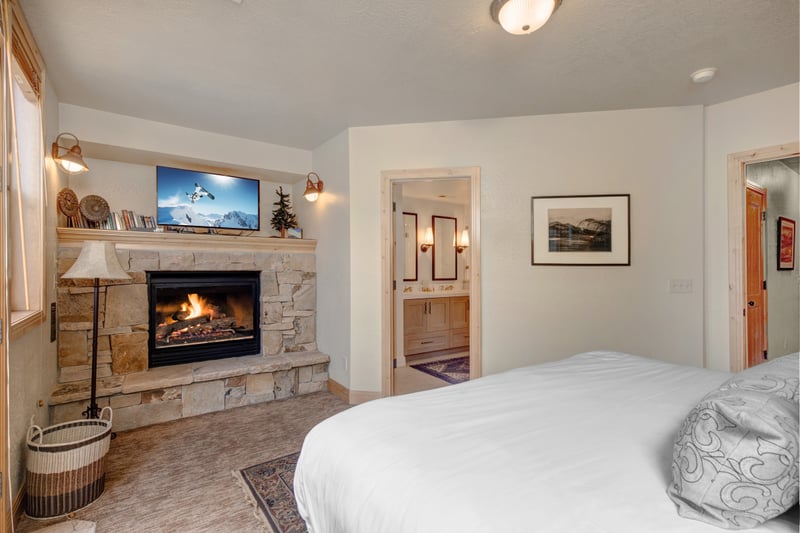 Enjoy the privacy of your lower-level suite with a King bed, gas fireplace, and direct access to the bath with walk-in shower.