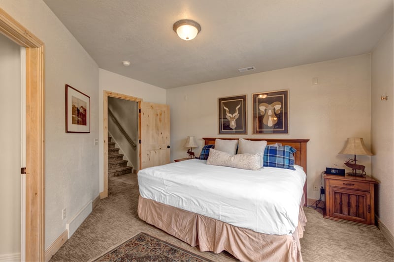 The lower-level King suite, offering peaceful retreat and easy access to the en-suite bath.