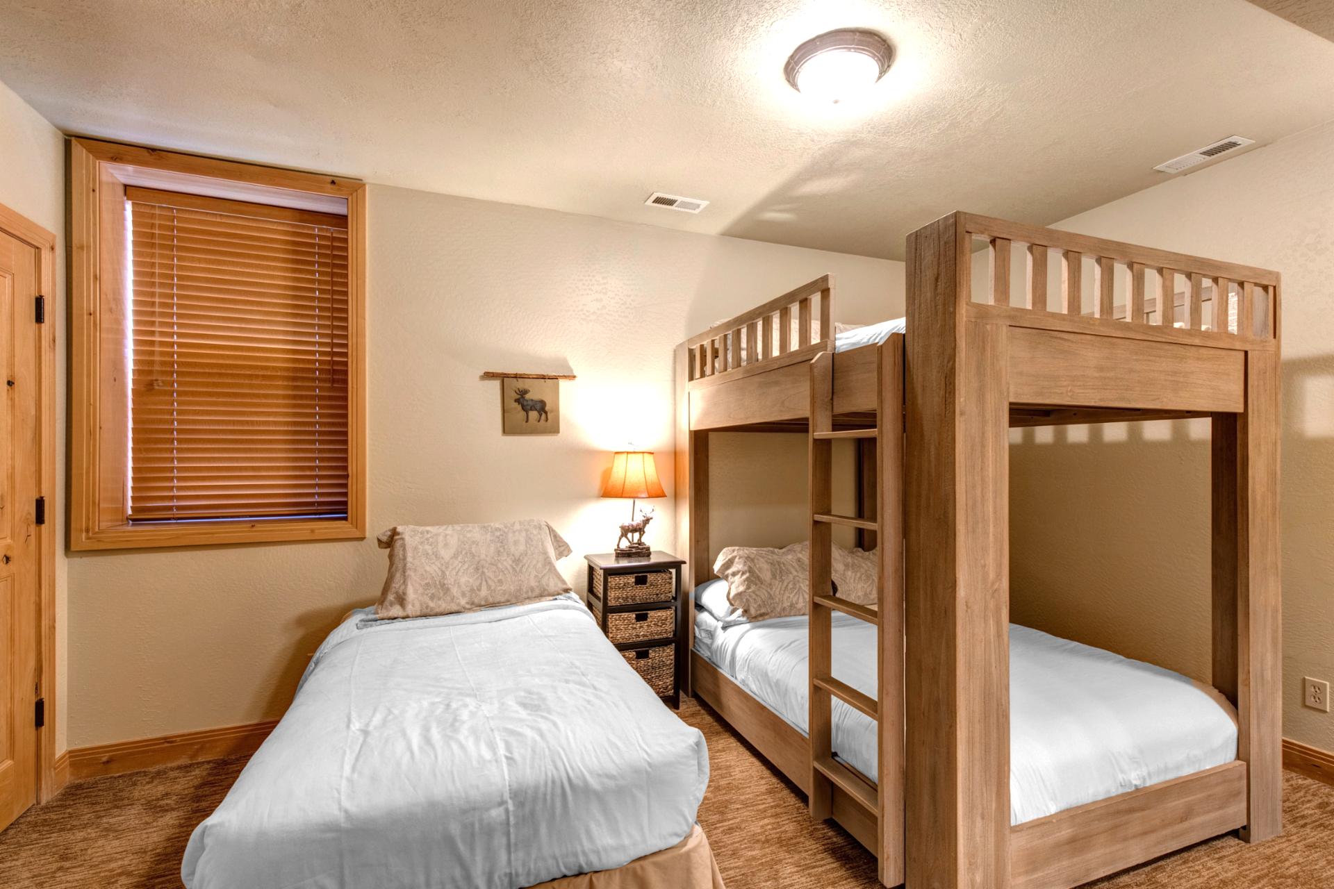 Ample sleeping space and a cozy layout make this third bedroom ideal for larger families or young travelers.