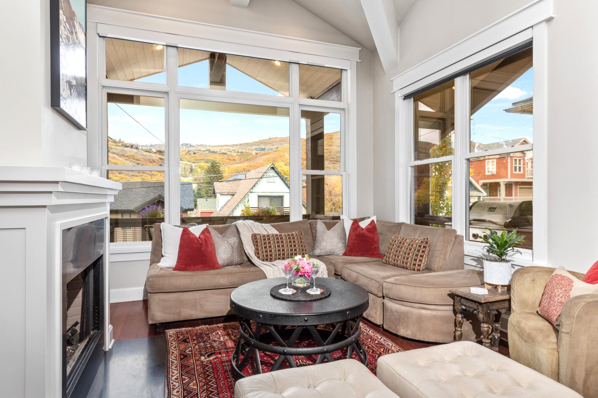 Cozy up by the fire in your living room with mountain views, vaulted ceilings, and plush seating.