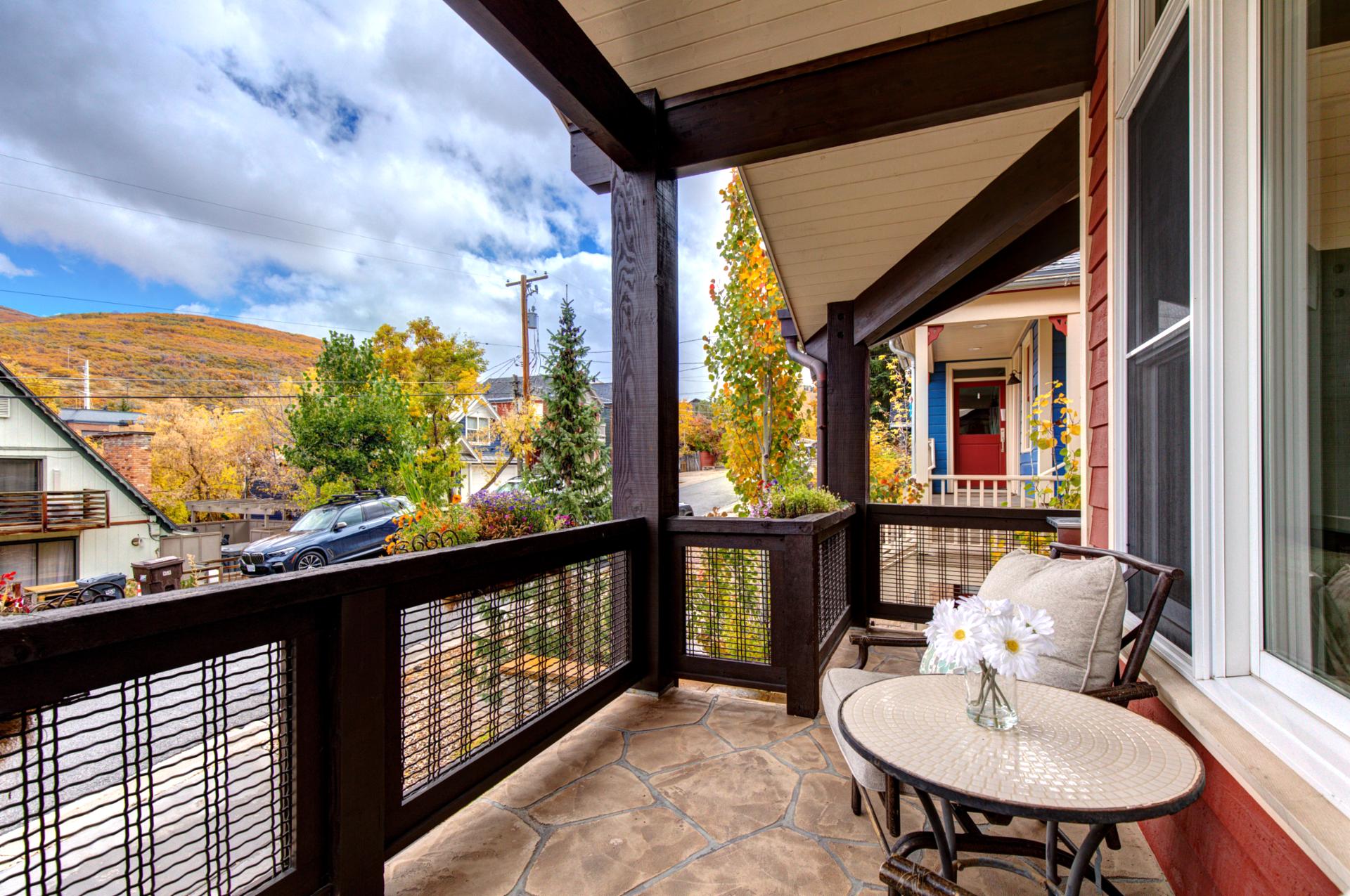 Private balcony with two lounge chairs and scenic views for relaxing in the fresh air.