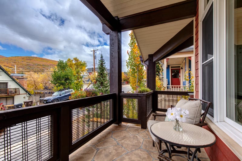 Private balcony with two lounge chairs and scenic views for relaxing in the fresh air.