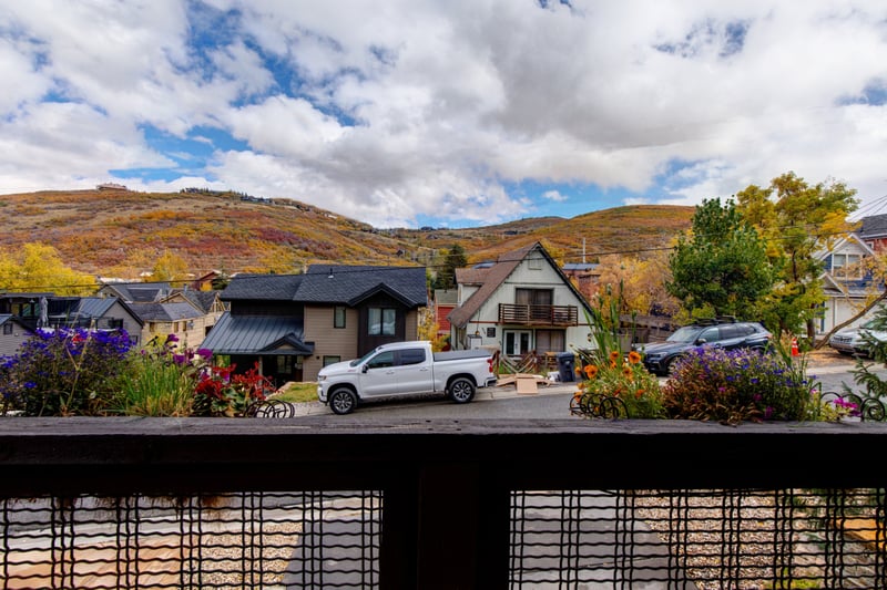 Look out across colorful rooftops and surrounding peaks from your elevated balcony.