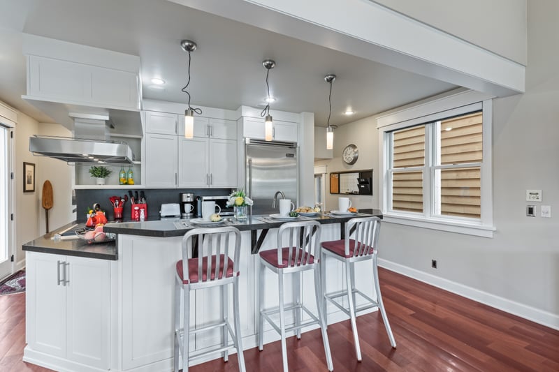 The kitchen highlights ample counter space and breakfast bar seating for four.