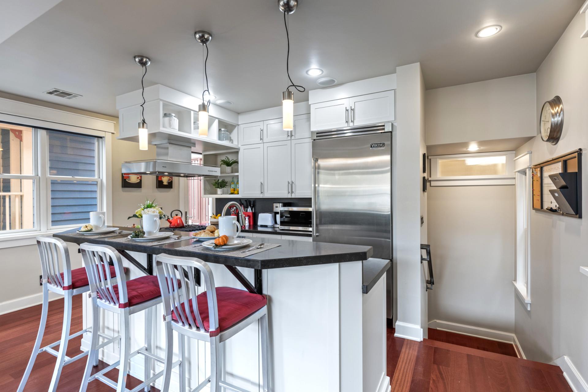 Open layout and modern finishes make this kitchen as functional as it is beautiful.