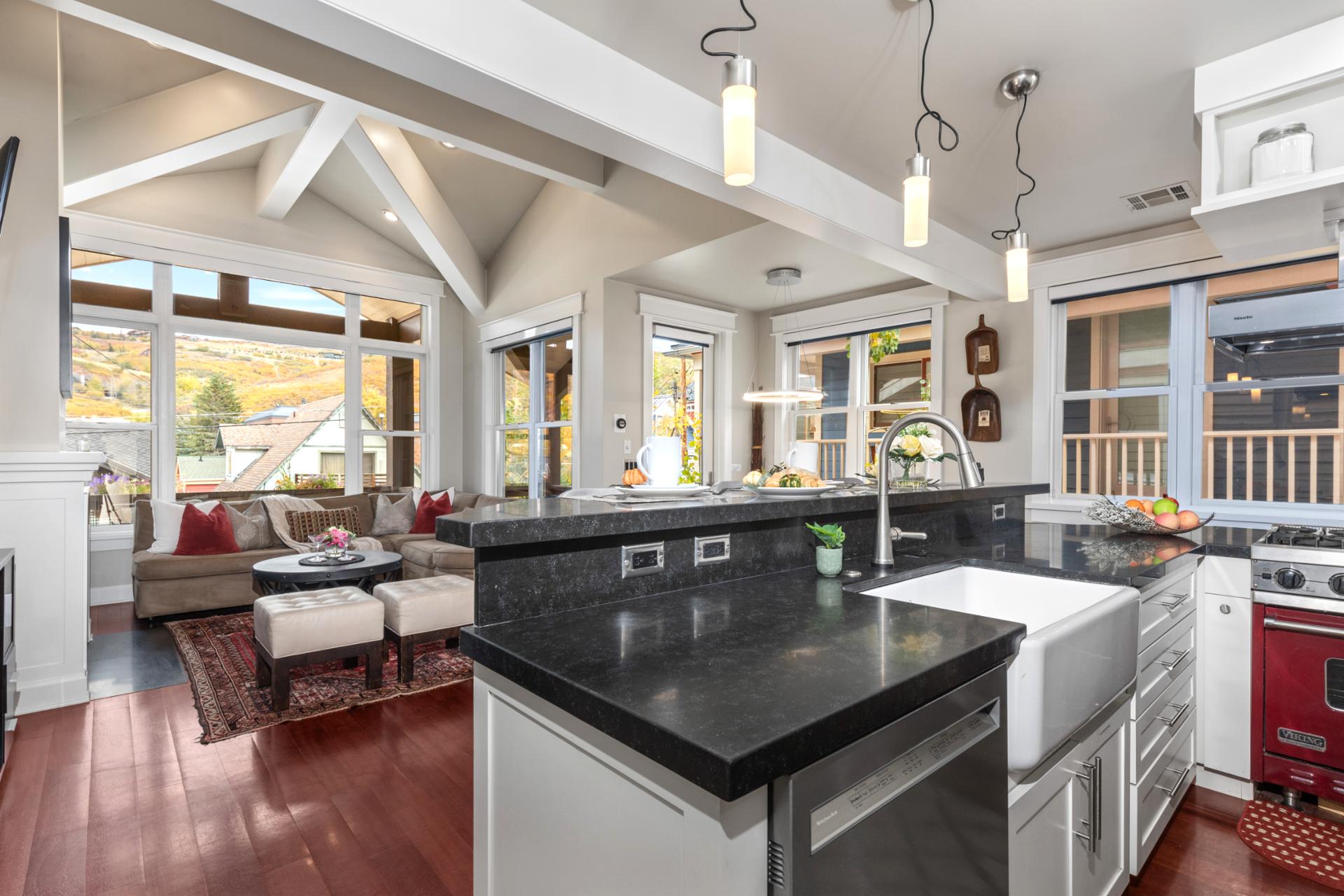 Bright and open with vaulted ceilings and mountain views, this kitchen invites easy group cooking.