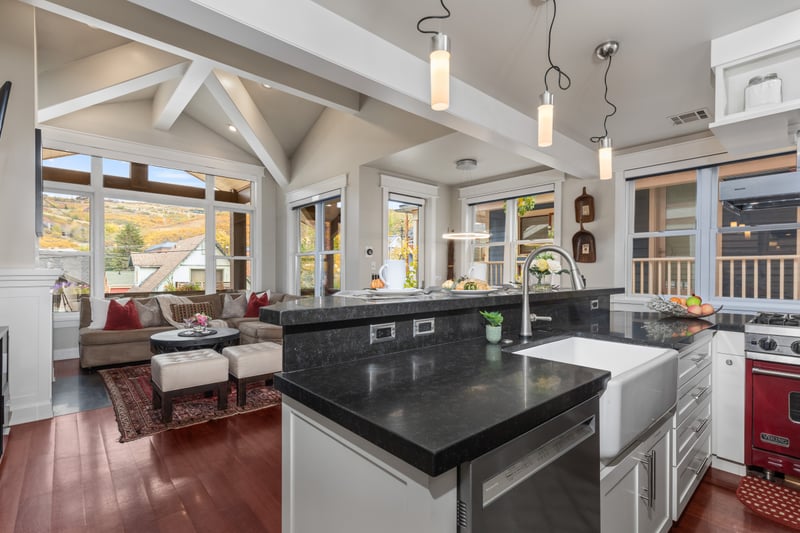 Bright and open with vaulted ceilings and mountain views, this kitchen invites easy group cooking.