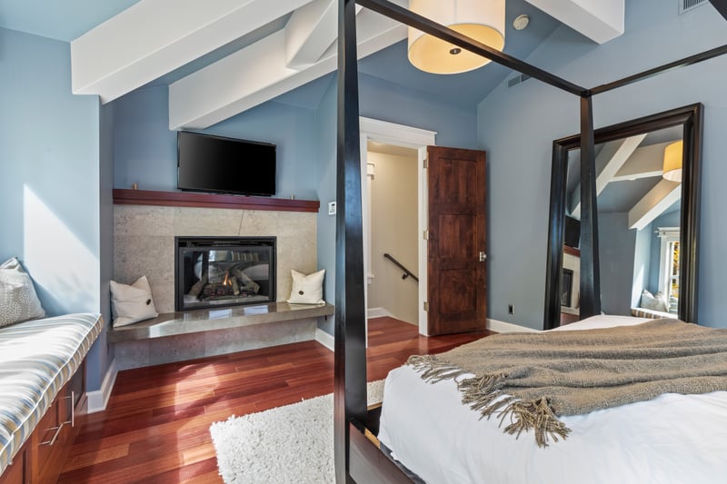 King suite with cozy window seating, natural light, and a private ensuite spa bath.