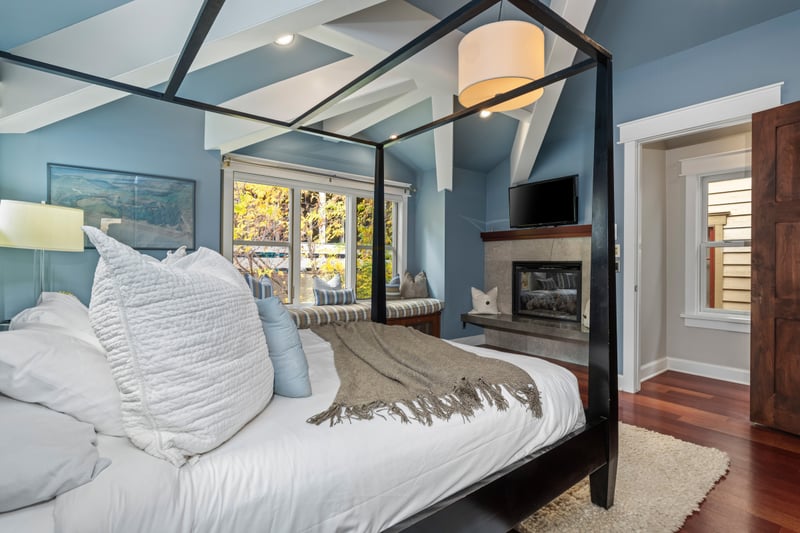 Relax in this serene space with plush bedding and gas fireplace.