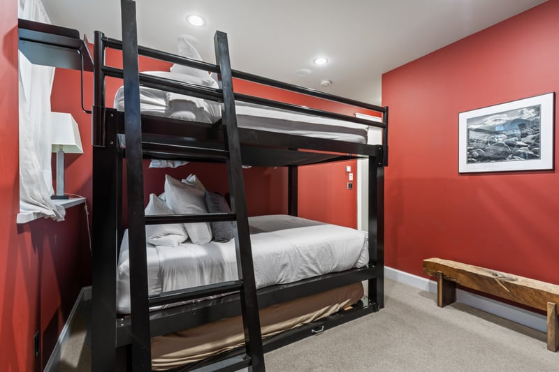 Queen-over-Queen bunks and pull-out Twin provide the perfect setup for kids or friends.