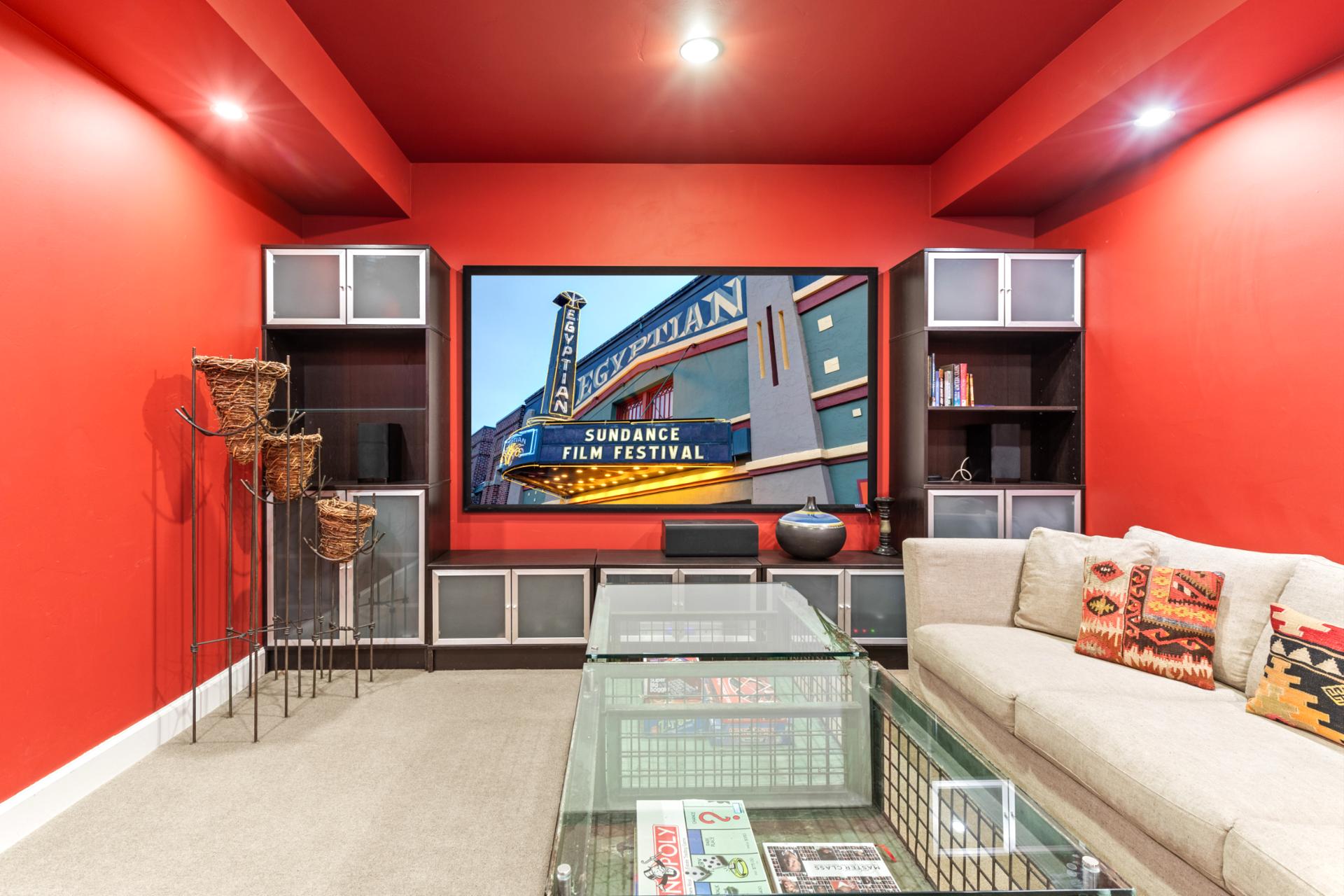 Catch a movie or game in this bold entertainment lounge with oversized sectional and large screen TV.