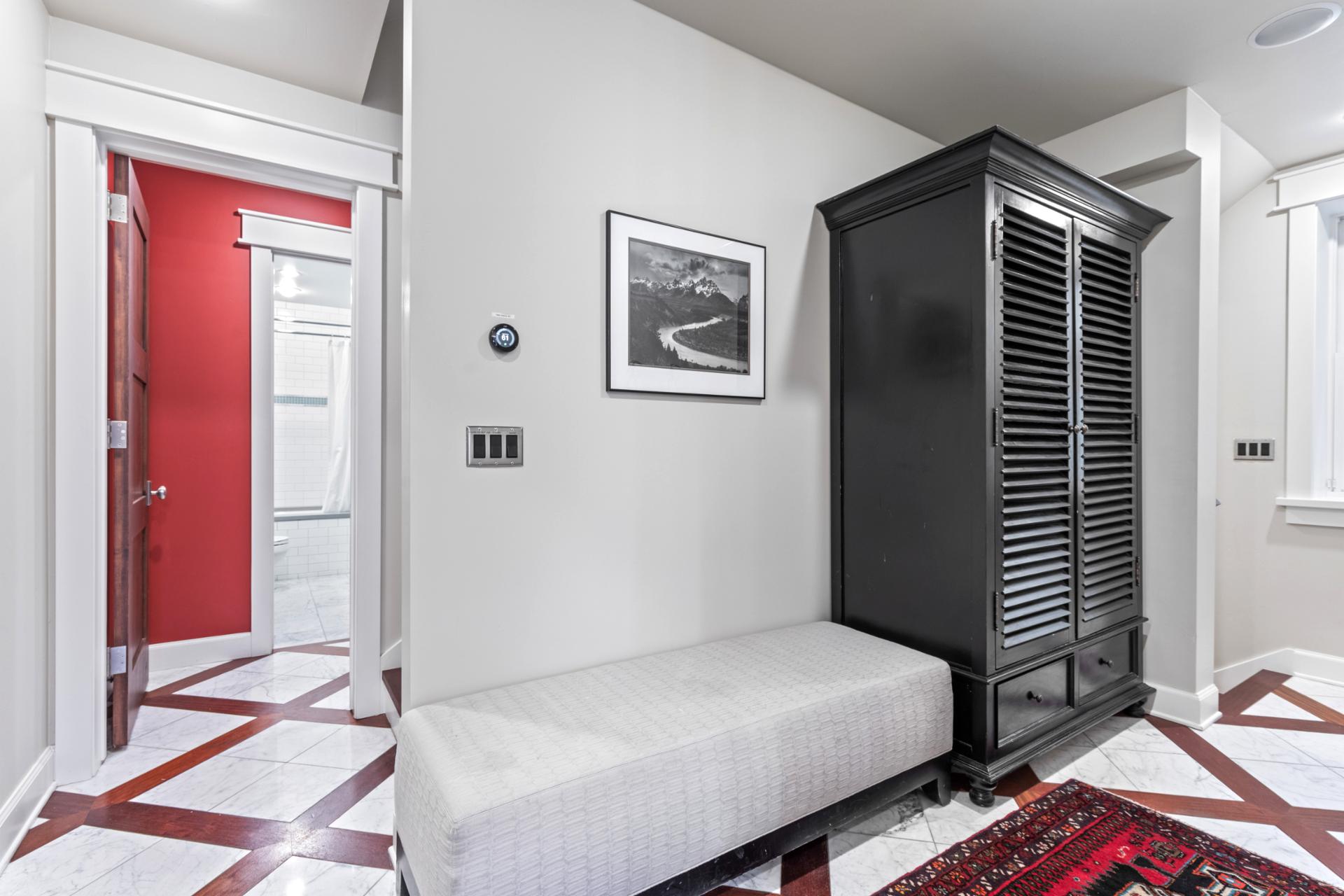 Tuck shoes, jackets, and gear into this stylish entry with bench seating and hooks.