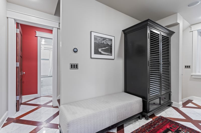 Tuck shoes, jackets, and gear into this stylish entry with bench seating and hooks.
