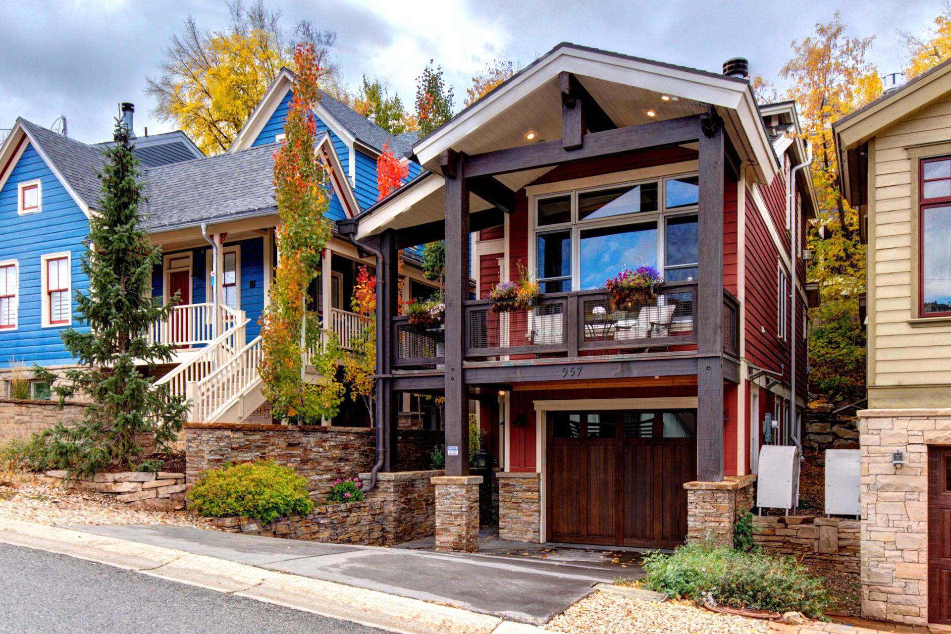 Exterior view shows classic mountain design with modern comfort and beautiful landscaping.