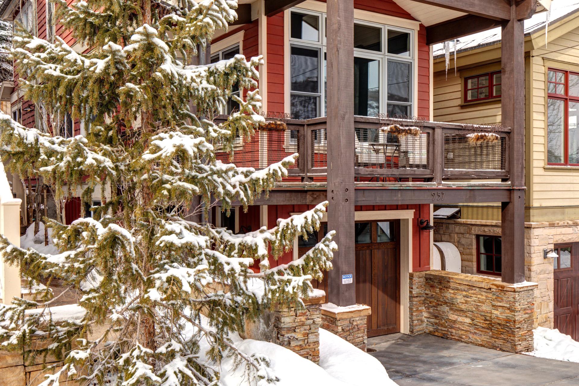 Snow-covered trees and wood accents set a warm tone for your mountain arrival.