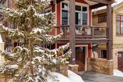 Snow-covered trees and wood accents set a warm tone for your mountain arrival.