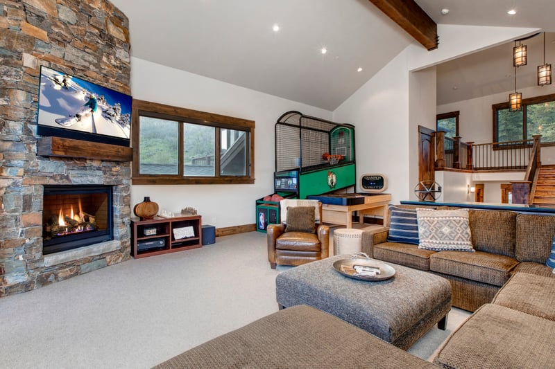 TV seating, warming fire, and basketball and wrap around shuffle table fun for all ages.