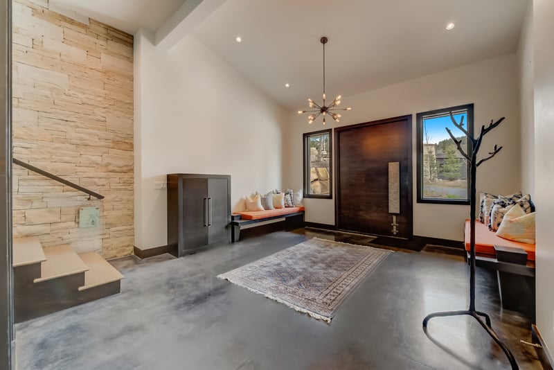 Alternate view of the foyer shows off modern fixtures and warm wood accents.