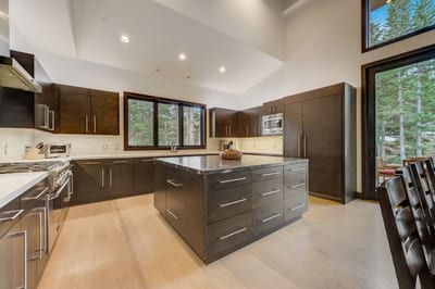 Sleek design meets function in your chef’s kitchen with island seating and open layout.