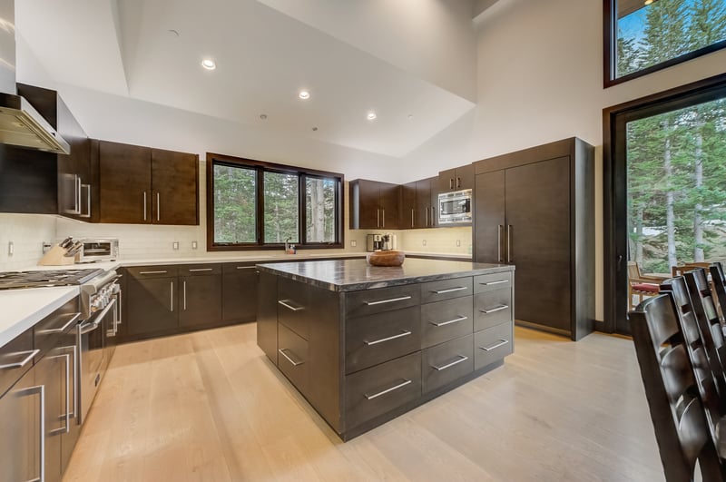 Sleek design meets function in your chef’s kitchen with island seating and open layout.