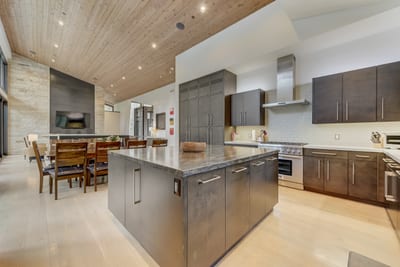 Dual fridges, stainless appliances, and prep space galore make cooking for a group effortless.
