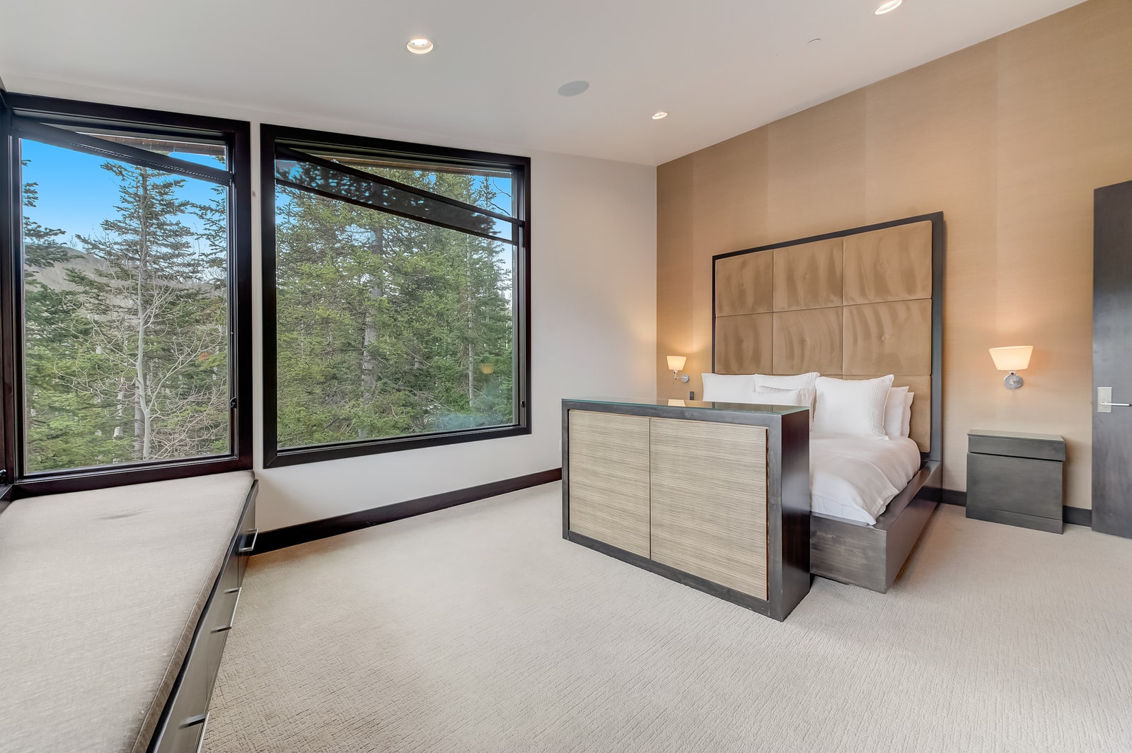 Corner windows and wood accents create a serene escape in your King suite.