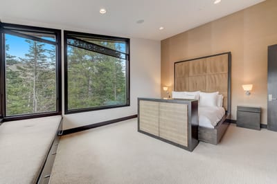 Corner windows and wood accents create a serene escape in your King suite.