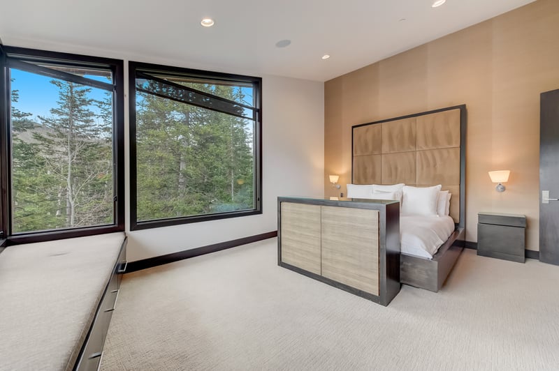 Corner windows and wood accents create a serene escape in your King suite.