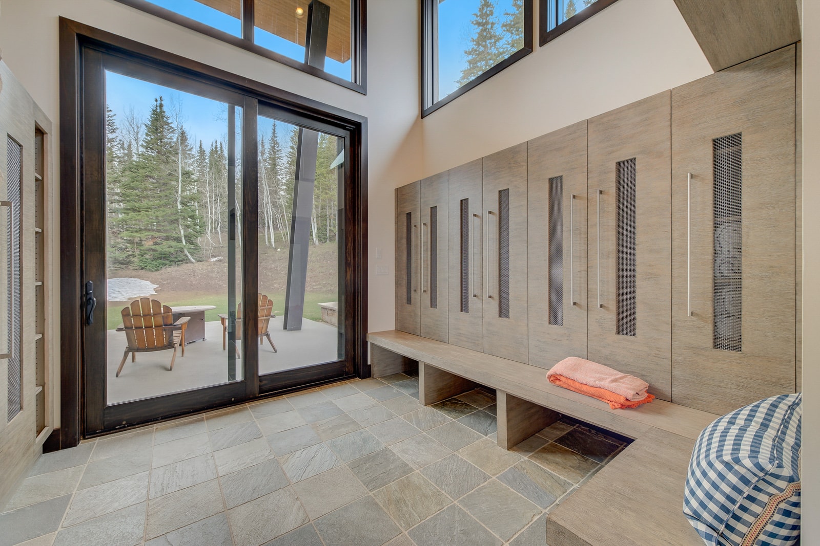 Spacious mudroom with cubbies, hooks, and bench seating keeps gear organized.