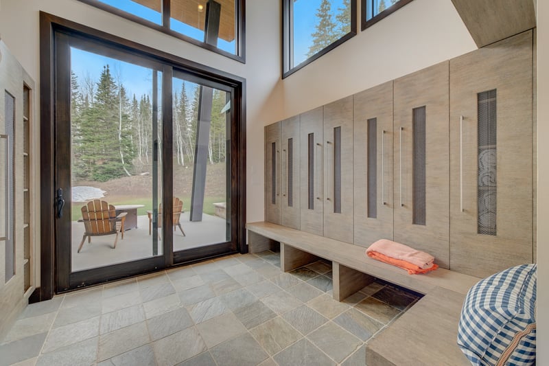 Spacious mudroom with cubbies, hooks, and bench seating keeps gear organized.