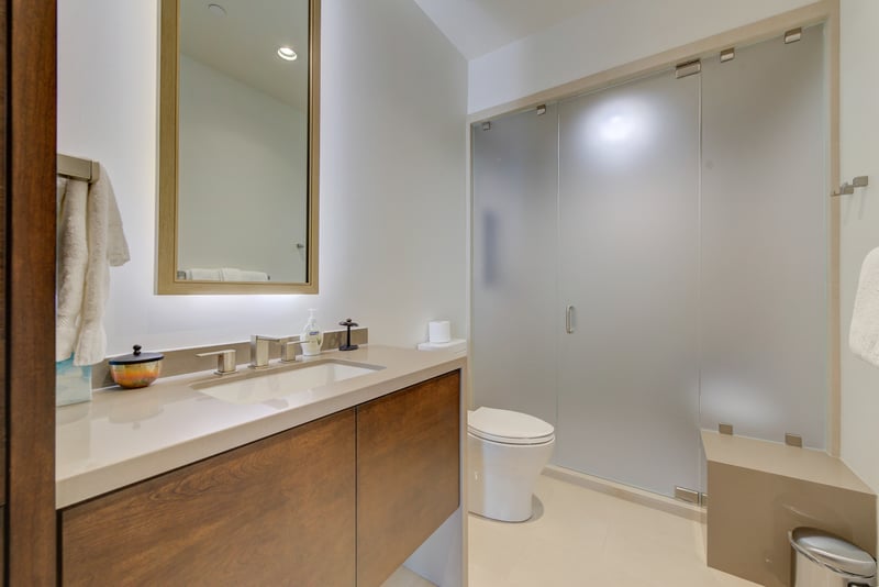 Full guest bath with step-in shower and sleek vanity.