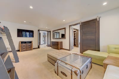 This oversized room includes lounge space, bunk beds, and TV for the whole group.