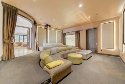 Home Theater Watch movies, play games, or unwind in this plush entertainment room with a giant screen.